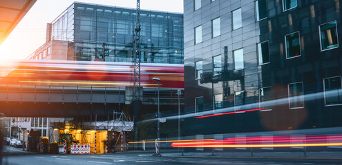 berlin city traffic rush in office district. cars and train motion blur long exposure shot