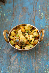 Indian recipe, mixed veg containing potato, Pea, CAULIFLOWER and Eggplant.