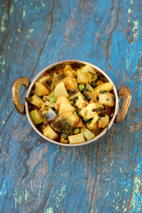 Indian recipe, mixed veg containing potato, Pea, CAULIFLOWER and Eggplant.