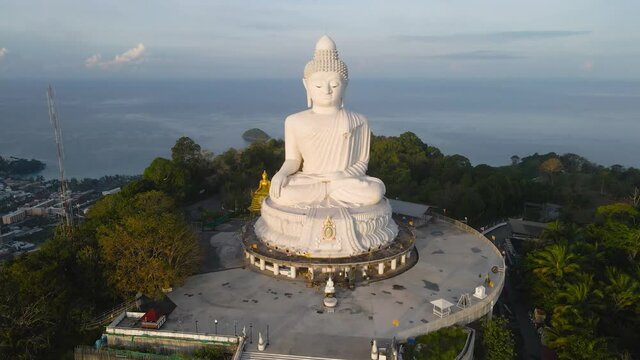 4K Aerial view Big Buddha in sunrise time and ocean background In Phuket Big Buddha statue. white Phuket big Buddha is the one of landmarks on Phuket island.