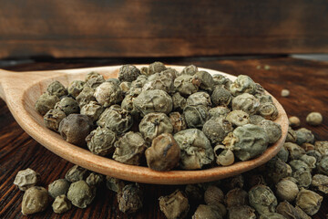 Macro photo of.green peppercorns on table