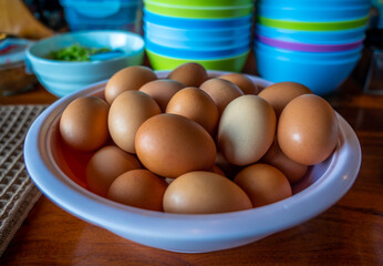 fresh eggs on a white cup, healthy food.
