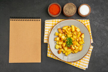 top view tasty fried potatoes inside plate with seasonings on dark background cuisine photo color food meal