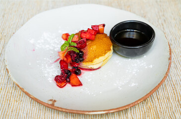 pancake with strawberry and maple sauce