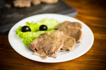 boiled beef tongue sliced in a plate