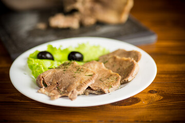boiled beef tongue sliced in a plate