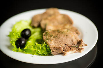 boiled beef tongue sliced in a plate