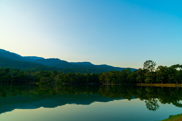 Naklejka na ściany i meble Ang Kaew lake at Chiang Mai University with forested mountain