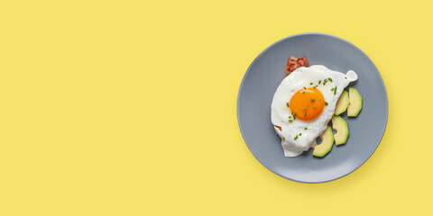 English breakfast - toast with bacon, avocado and egg on a plate. Healthy food. Top view