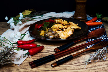 wok fried chicken stir fry with sweet peppers and chinese vegetables