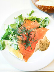 Grilled salmon and lemon - french cuisine dish with tomato and salmon