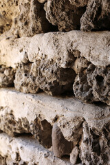 Textured old medieval stone rocks strong  gray wall close up, stony background pattern  