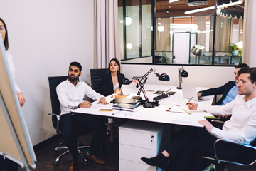 Focused diverse coworkers discussing strategy