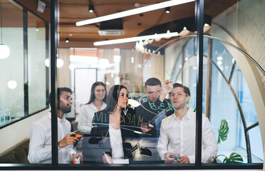Group of multiethnic coworkers working on strategy