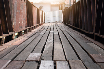View to the front of the bridge With several planks Connect the corridors in rural towns.