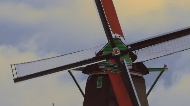 Close up of spinning colourful blades of traditional historic Dutch windmill in Zaanse Schans North Holland Nederland Netherlands sustainable clean energy tourist attraction