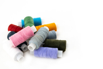 set of thread assorted bright pink, yellow, gray and black yarn for embroidery on a white background