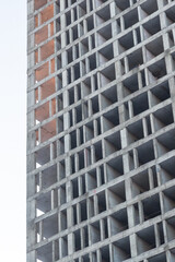 facade of unfinished house high cement foundation closeup vertical background construction