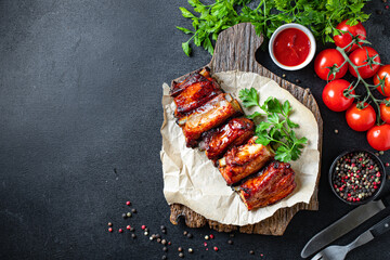 meat ribs piece grilled BBQ spice sauce second course snack ready to eat on the table meal top view copy space for text food background rustic