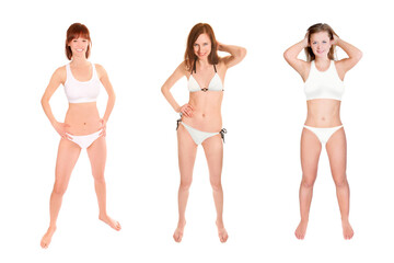 Full length portraits of three erotic young women wearing bikinis, isolated on white studio background