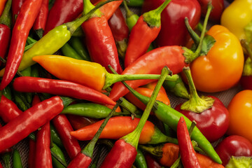 assorted colorful peppers yellow and red closeup vegetable background