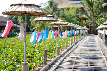 colorful fabric lamp lantern decorating along wooden bamboo bridge