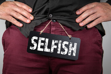 Selfish. Psychology, character traits and behavior. Man with a chalkboard