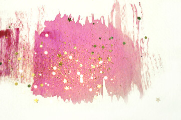 Golden glitter and glittering stars on abstract pink watercolor splash in vintage nostalgic colors