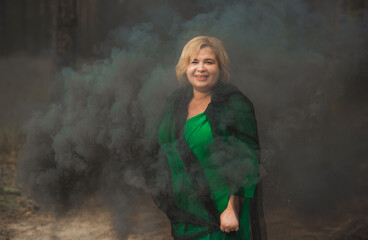 Obraz premium Nice plump lady portrait, lifestyle elegant woman, American chubby woman with a colorful bomb having fun outdoor