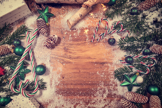 Christmas wooden background with snow fir tree. View with copy space