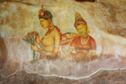 Sigiriya maiden with fruits: one of the 5th century frescoes at the ancient rock fortress of Sigiriya, a UNESCO World Heritage Site in Sri Lanka