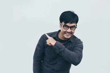 Fototapeta premium adult asian man.young male wear eye glasses.posing smiling look excited surprised thinking positive happy joy life.empty,copy space for text advertising.white background.attractive fashion people