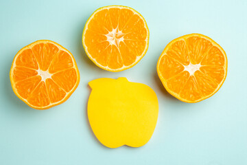 top view fresh tangerine slices with sticker on light-blue background photo fruit color juice citrus orange