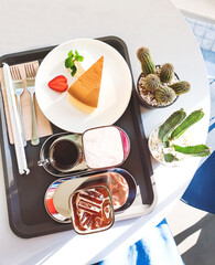 Table set for ice americano and ice chocolate milk served with home made cheese cake, Afternoon tea.