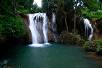 Fototapeta na wymiar Waterfalls in the jungle of Thailand The abundance of forests