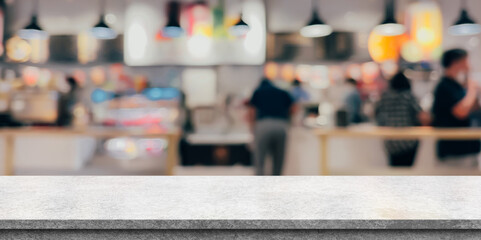 Empty white marble stone table top and blur interior cafe and restaurant.