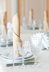 Elegant tableware of the festive table in light colors