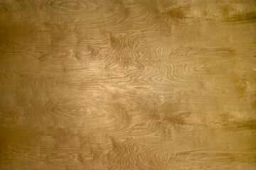 Finely finished smooth wood grain background stained warm golden brown