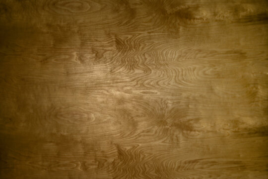 Finely finished smooth wood grain background stained warm golden brown