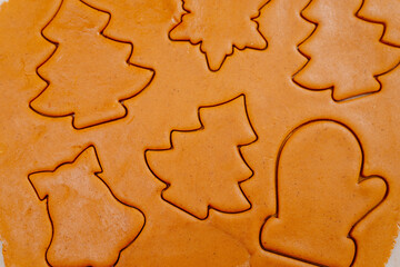 Gingerbread. The process of making homemade Christmas gingerbread. The woman bakes and decorates Christmas gingerbread.