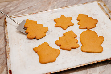 Gingerbread. The process of making homemade Christmas gingerbread. The woman bakes and decorates Christmas gingerbread.