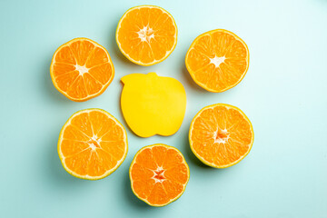top view fresh tangerine slices with sticker on the light-blue background photo fruit color juice citrus orange