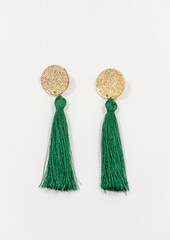 Golden earrings with green tassels 