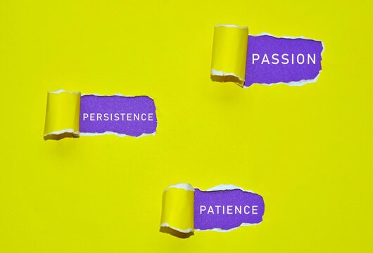 Text written on yellow torn paper with purple background. Success concept