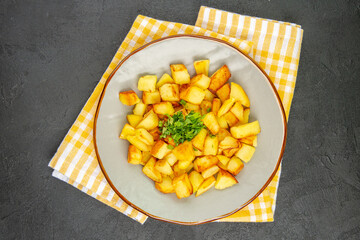 top view tasty fried potatoes inside plate on dark-grey background meal color photo cuisine food