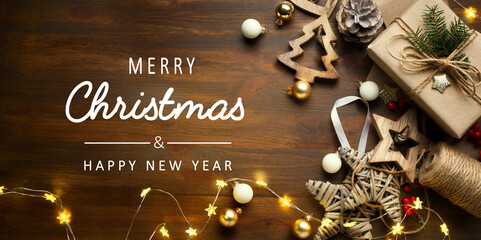 art Christmas banner, Xmas sparkling lights garland with gifts box and wooden tinsel. Christmas greetings cards, headers, website. © Konstiantyn