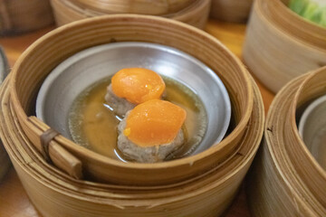 close up of variety dim sum in bamboo basket