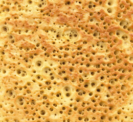Textured background of delicious fried pancake