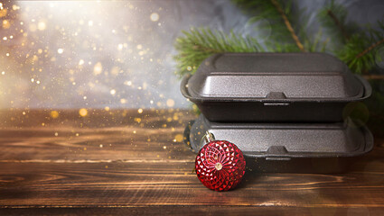 Christmas decor of food delivery service containers and pizza box. New year's eve promotion....