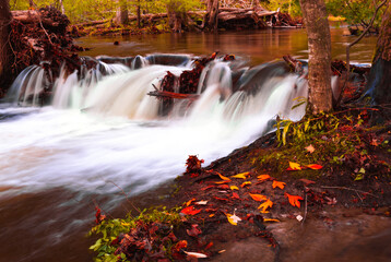 Autumn Fall Colors With Running River Falls